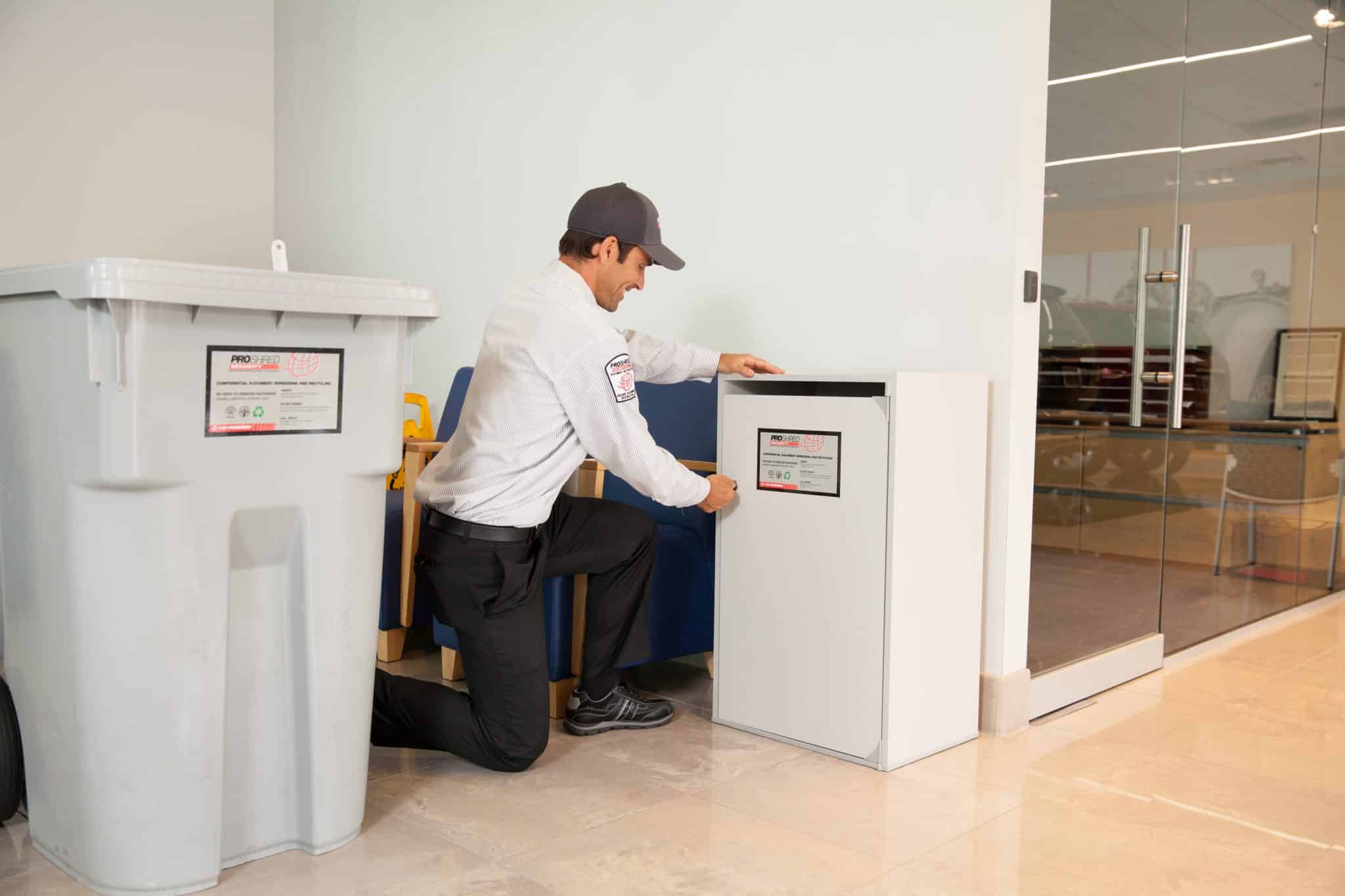 PROSHRED employee locking a 36" security console.