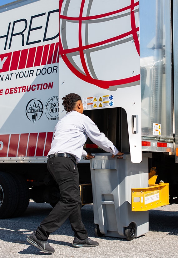 PROSHRED employee operating a mobile shredding truck.