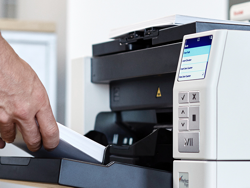 Person scanning a document.