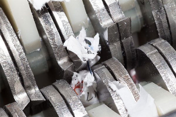 Industrial paper shredder in action.