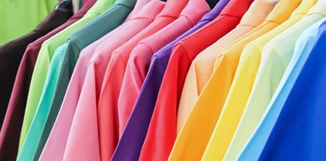 row of shirts colored like the rainbow