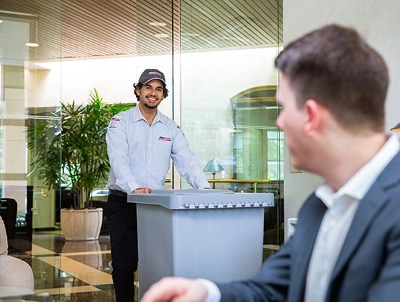 PROSHRED employee with a secure console  bin