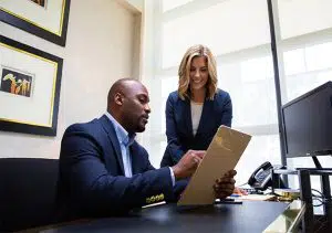 Legal shredding - two professionals reviewing some paperwork