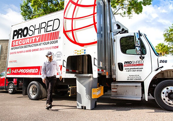 PROSHRED driver shredding confidential documents with our mobile shredding trucks