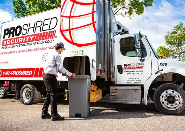 Proshred employee shredding confidential material