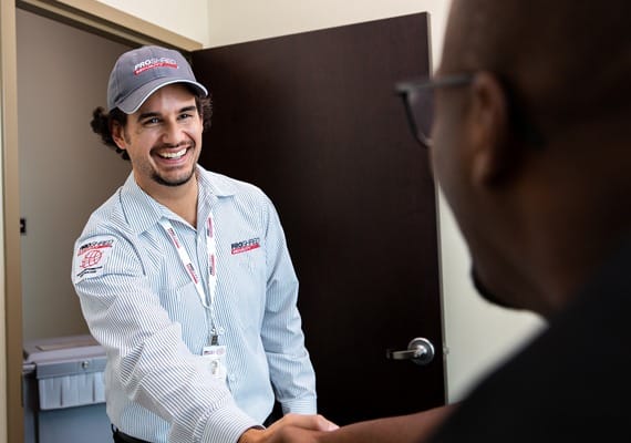 PROSHRED employee shaking hands with a client