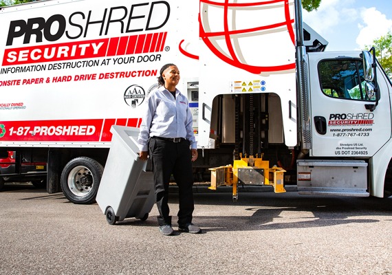 PROSHRED driver shredding documents with our onsite shredding trucks