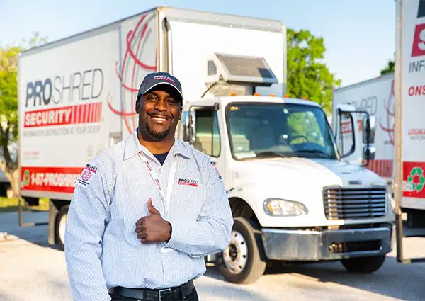 residential shredding employee infron of mobile shredding truck