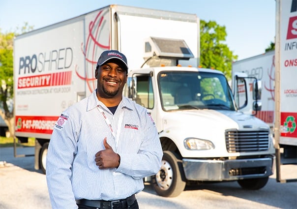 residential shredding employee infron of mobile shredding truck