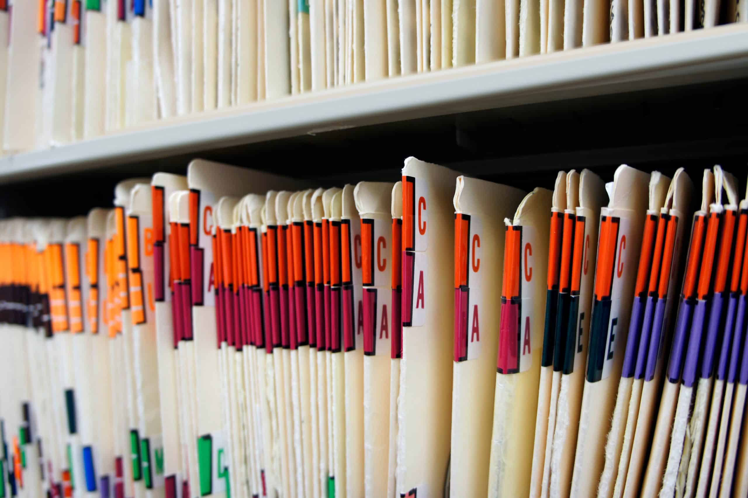 Paper medical records filed neatly.