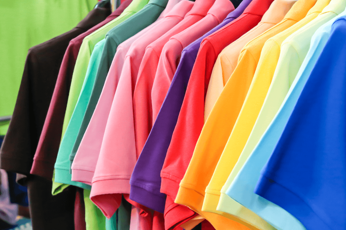 A row of colorful T-shirts later destroyed through shredding services
